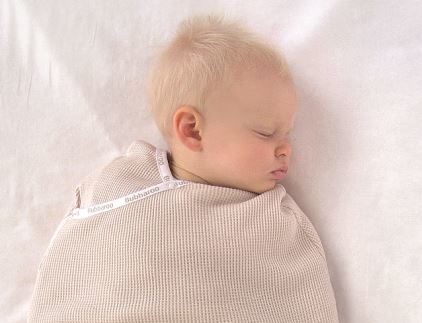 Emily asleep in Joey Pouch Swaddle